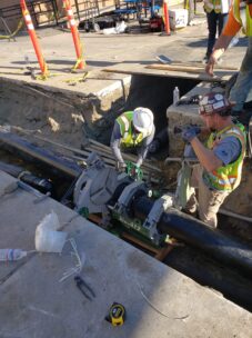 2 workers fusing pipe